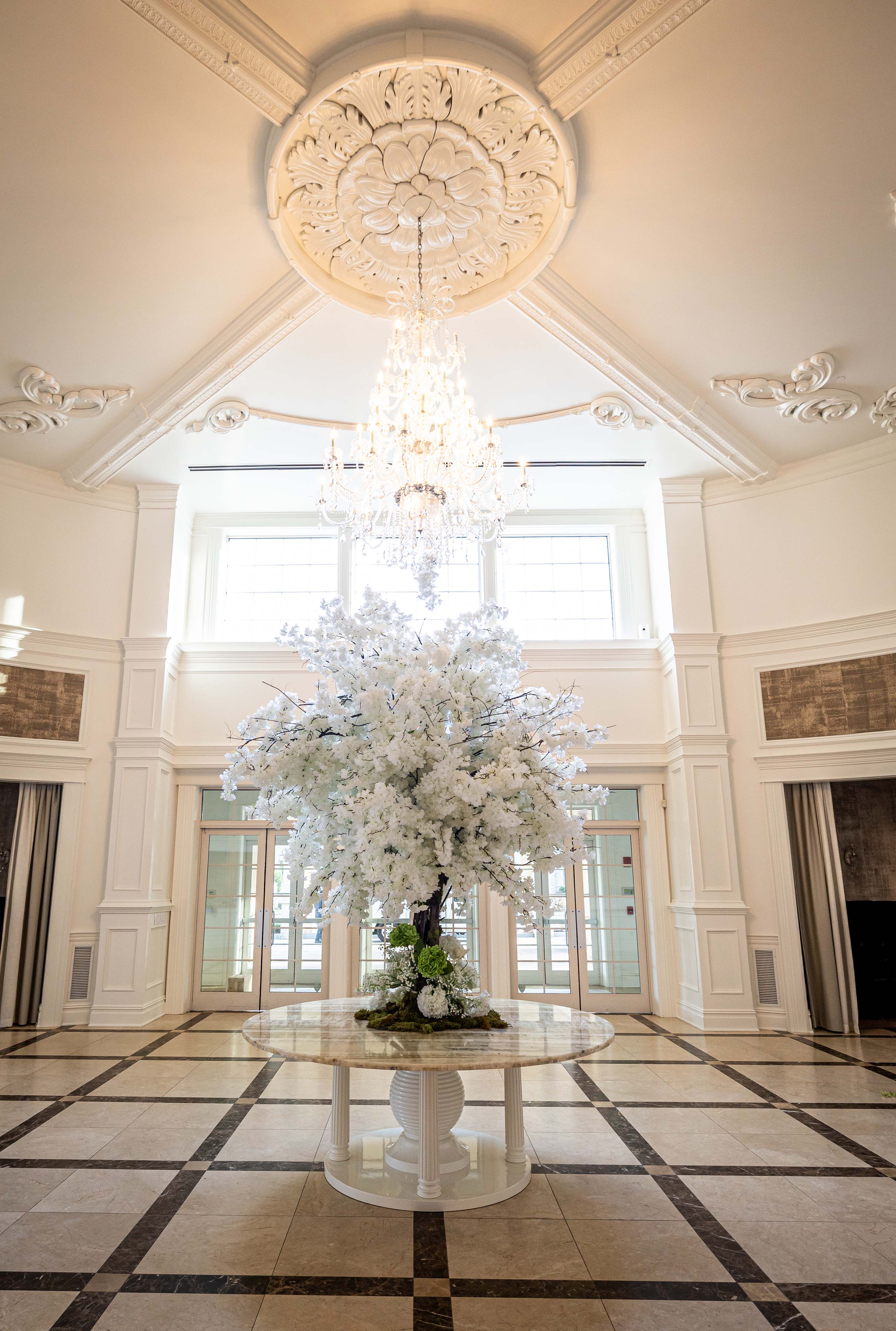 aria grand foyer with a elegant display of flowers in the center