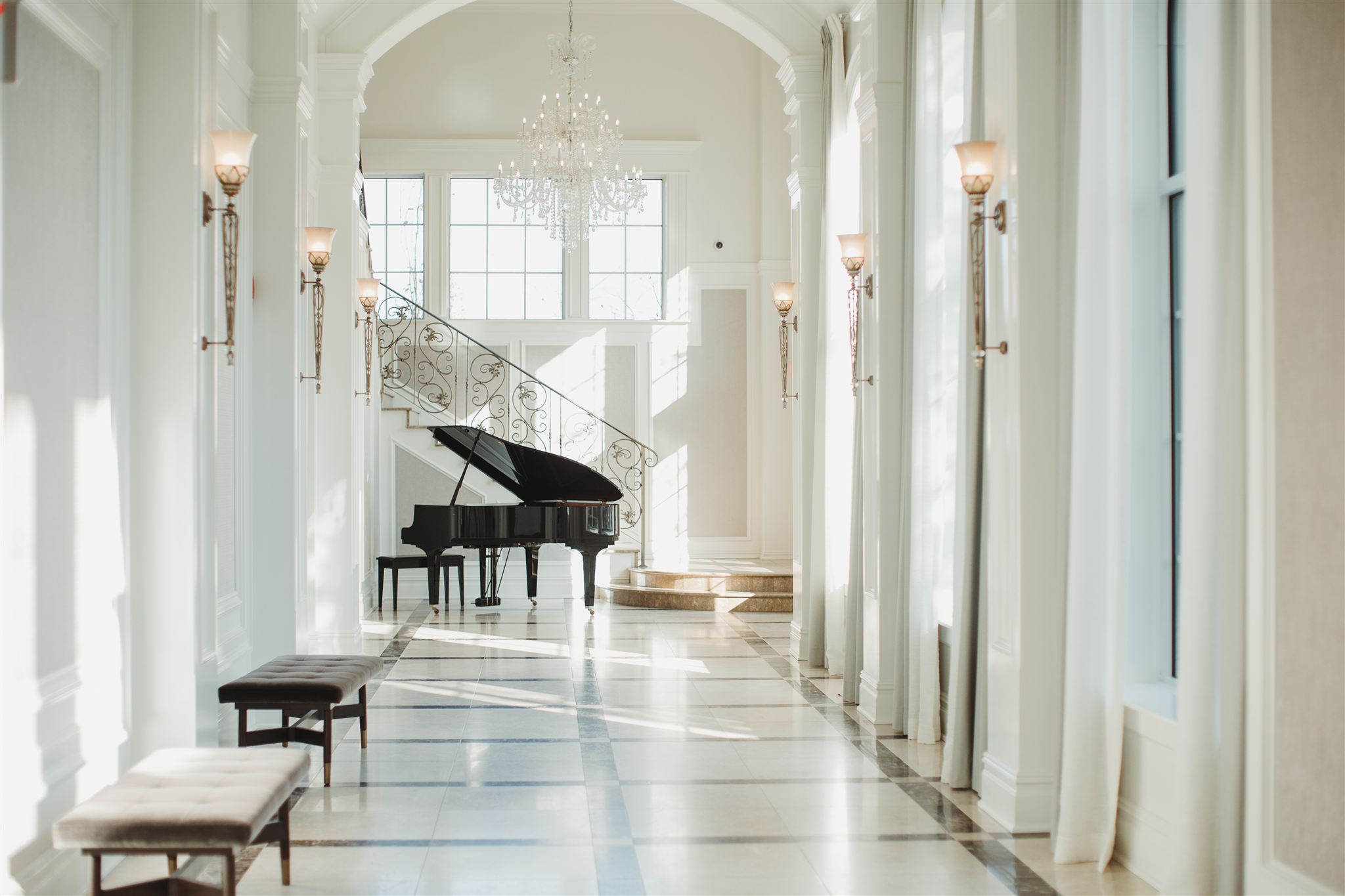 aria banquet foyer with piano at end of hallway