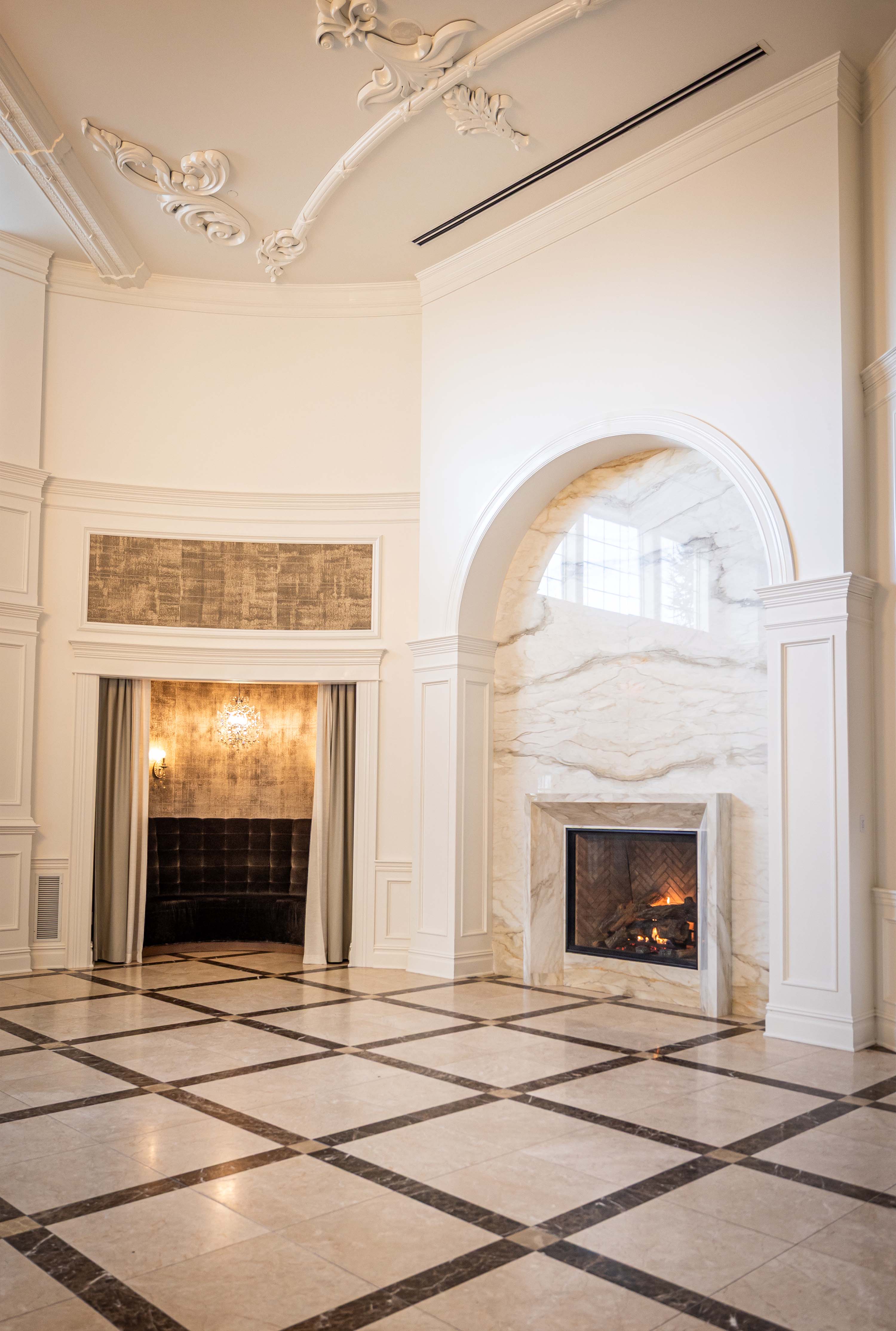 fireplace in the grand foyer next to the seating area