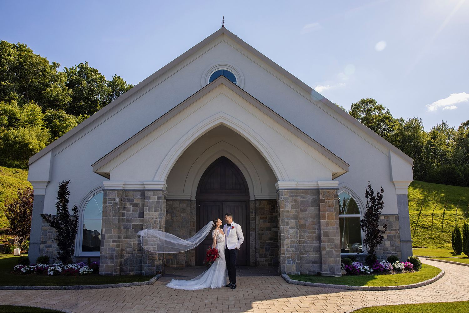 bride and groom gazing at each other outside of aria's chapel
