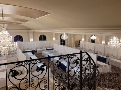 Aria ballroom set up with white trade show booths.