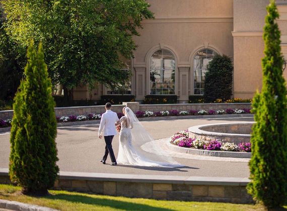 a Birds Eye shot of a bride and groom walking outside