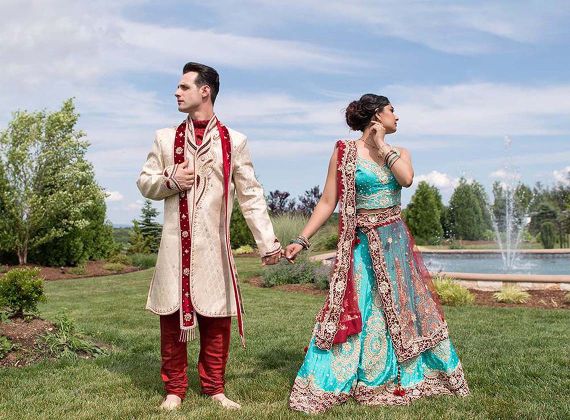 Cultural wedding couple standing outside